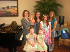 Top Row:  Me and Ethan with my students Emily, Eliza and Elora.  Seated: Mary age 5 and my Lucy.  Taken in 2010.